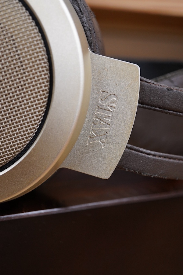 A pair of over-ear Japanese Stax Electrostatic earspeakers, SR-009S, contained within the original wooden box, with outer packaging, owners manual, etc. together with the Stax driver unit for earspeakers with vacuum tube